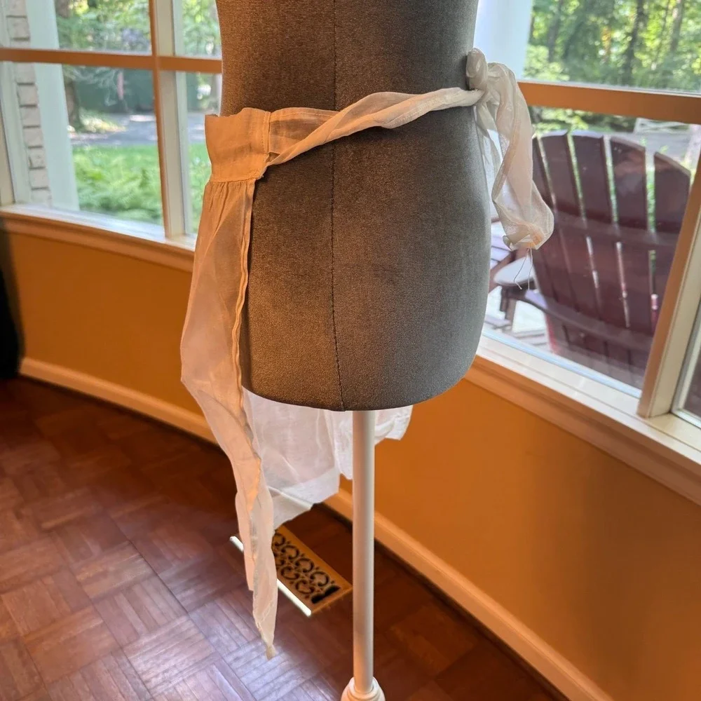 Vintage sheer chiffon or organdy half apron with lace trim and a single pocket